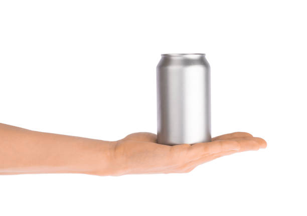 istock Hand holds metal beverage drink can isolated on white 1186361550