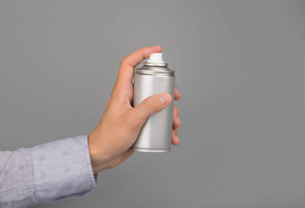 istock hand holds aerosol spray can 1186362205