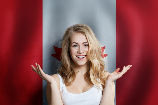 Canadian concept with happy Surprised cute girl with Canada background. Travel and education concept