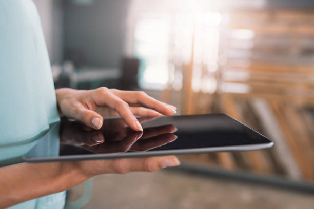istock Businesswoman working in an office with a digital tablet 1186362900
