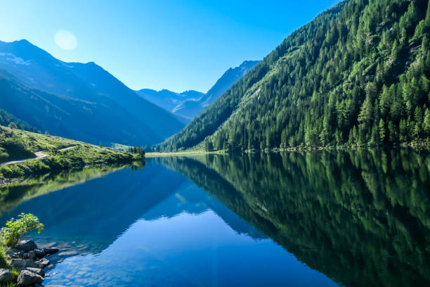 istock Schladming - Lake reflecting the mountains 1186363606