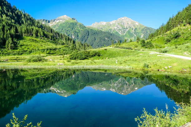 istock Schladming - Lake reflecting the mountains 1186363710
