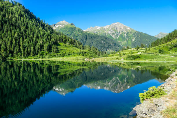 istock Schladming - Lake reflecting the mountains 1186363719