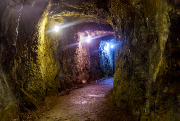 istock Mining industry underground mine tunnel with lights 1186364127