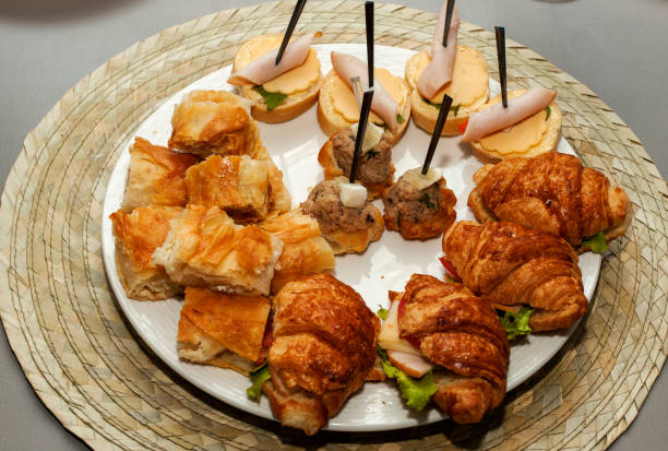 istock Bread rolls with grapes, meat and prawn. 1186364129