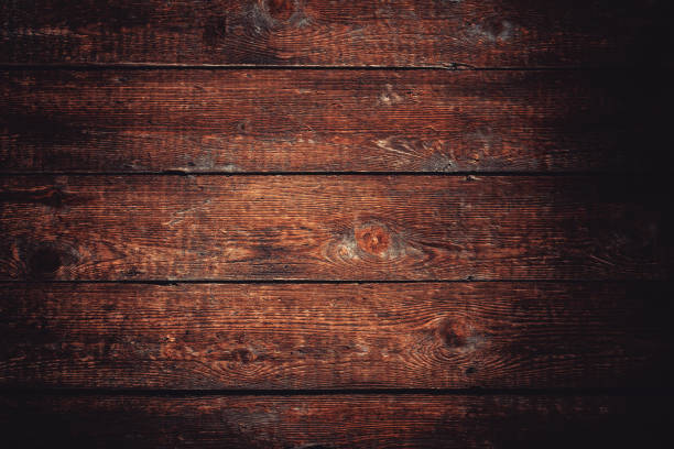 istock dark brown wood background 1186366078