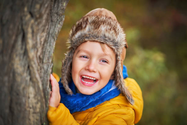 istock Happy child boy playing outside in autumn 1186368619