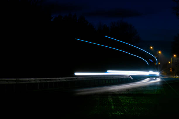 istock lights of cars with night 1186368719