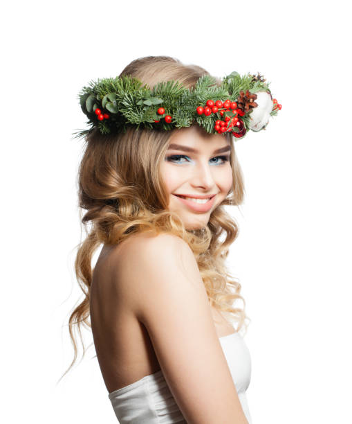 istock Beautiful smiling woman Christmas model isolated on white 1186369007