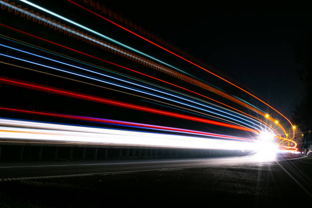 istock lights of cars with night 1186369106