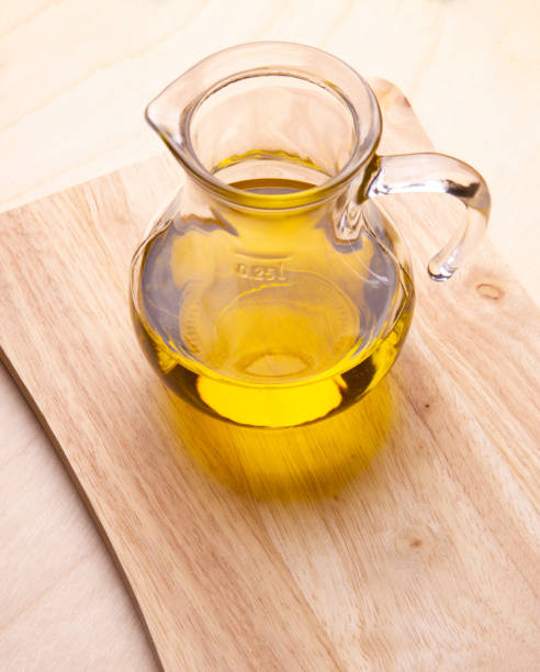 istock Olive oil on wood table 1186370471