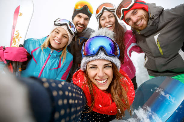istock Happy couple having fun in snowy nature 1186371709