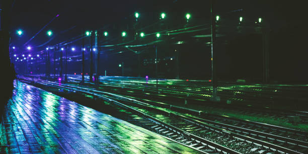 istock Railway station in rainy night with reflection 1186372590