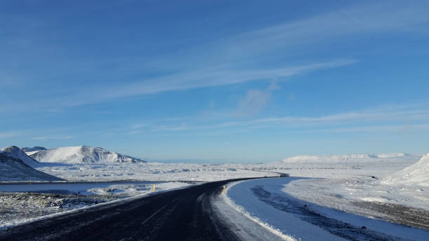 istock Road Through Snow Covered Landscape in Iceland 1186373809
