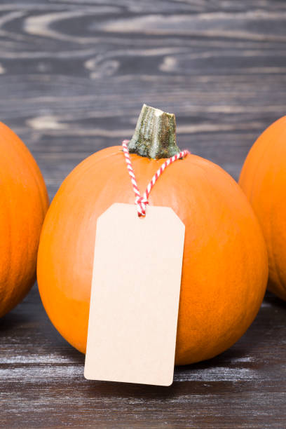 istock pumpkin with a paper tag 1186375326