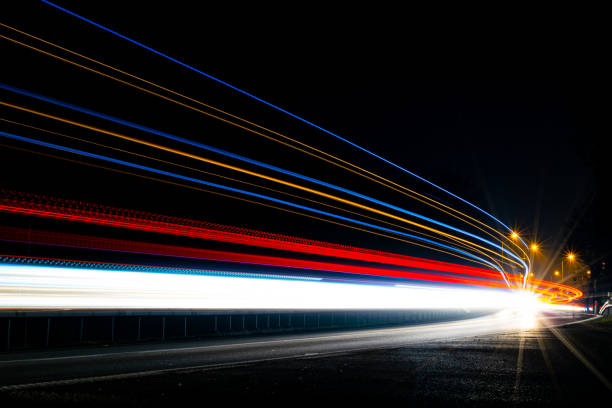 istock lights of cars with night 1186376708