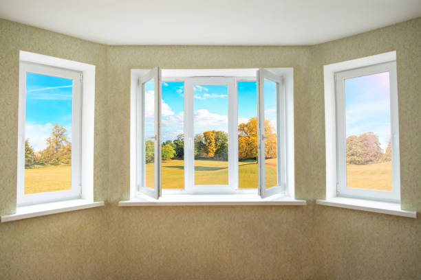 istock View through a opened modern PVC window onto beautiful autumn landscape 1186376772