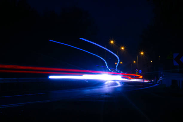 istock lights of cars with night 1186376791