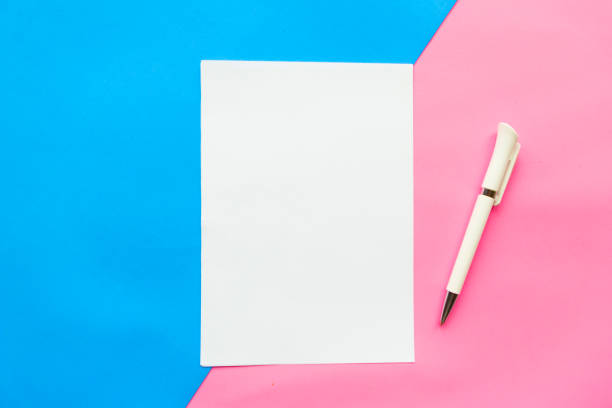 istock white mockup blank and pen on geometric blue and pink background 1186377928