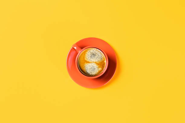 istock One cup of coffee on yellow background. 1186377931