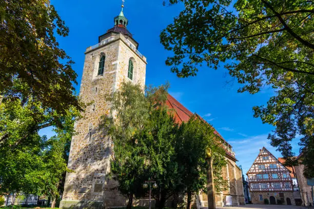 Germany, Beautiful stone church building city church, called martinskirche in downtown kirchheim under blue sky on sunny day