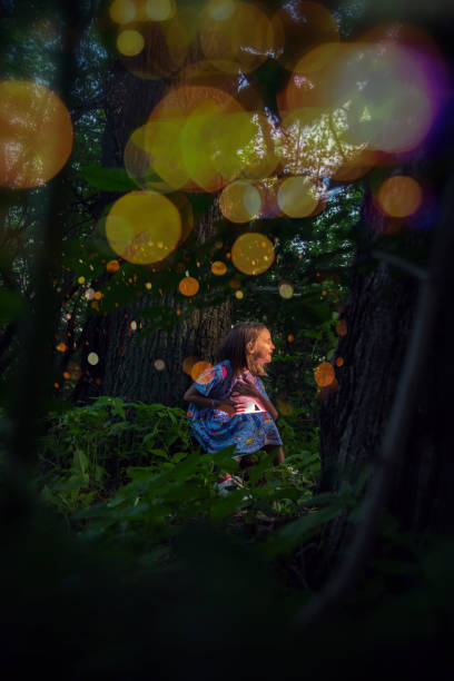 istock Little girl holds a glowing crystal 1186381853
