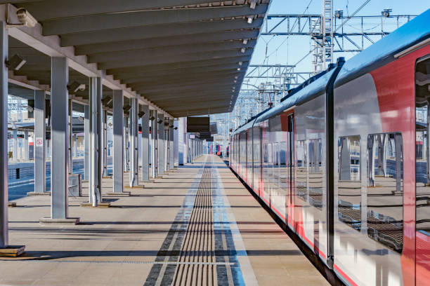 istock Passenger train approaches to the platform at evening time. 1186382133