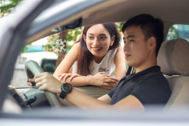 istock happy young couple discuss on new car purchase, customer satisfaction 1186382682