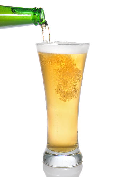 istock Beer pouring from bottle into glass 118638550