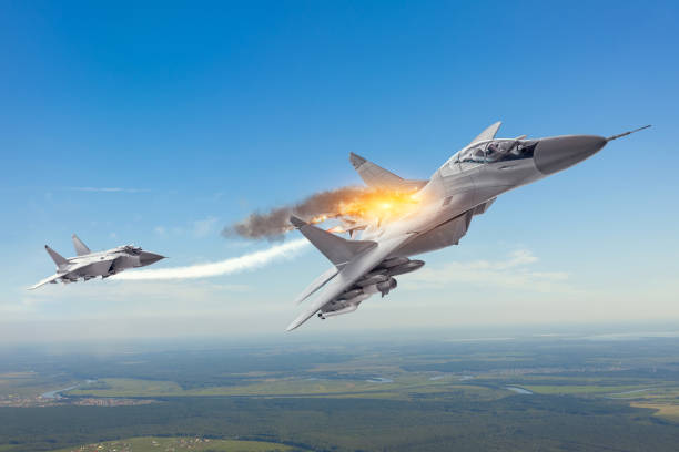 istock Combat fighter launched a homing missile and explosion hit a target with another plane jet. Conflict, war. Aerospace forces. 1186386313