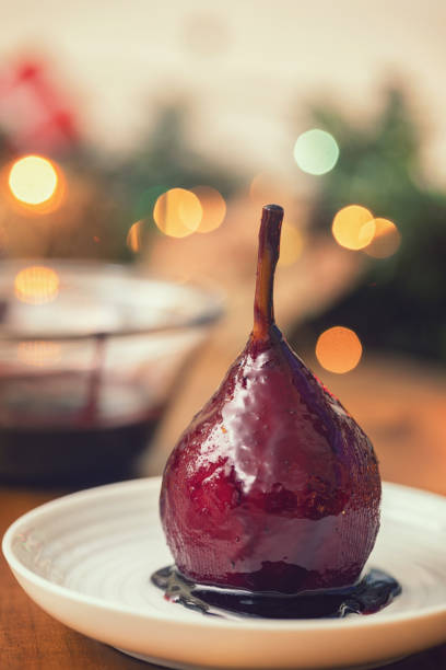 Poached Pears in Vanilla Lemon Syrup glazed with Dark Chocolate