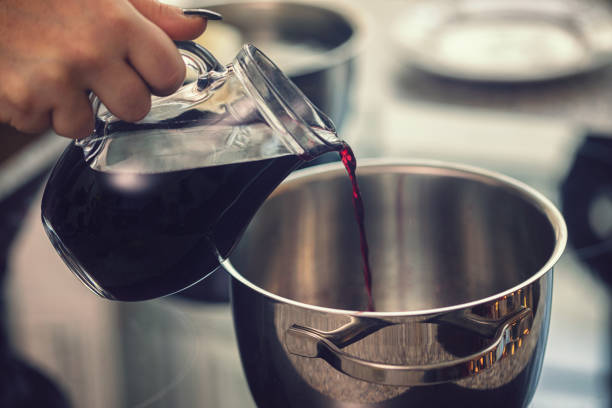 istock Preparing poached pears in red wine for the holidays 1186387639