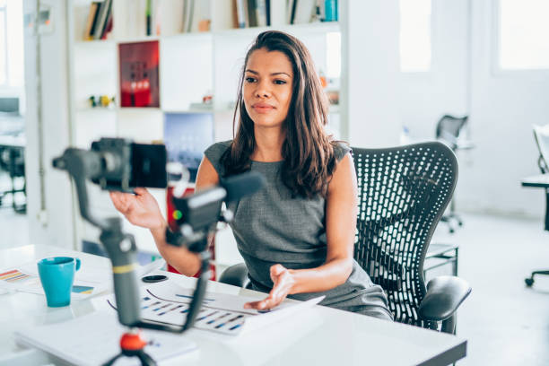 istock Businesswoman vlogging at the office 1186389215