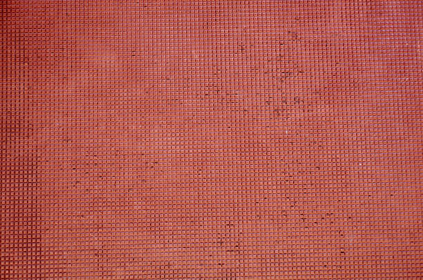 istock Texture of wall covered with small red mosaic tiles 1186393831