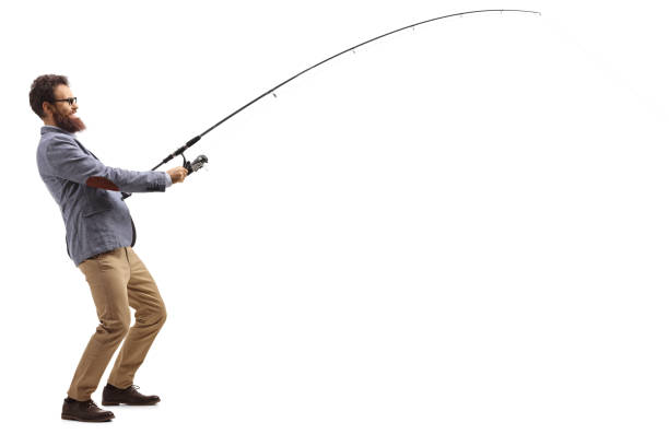 Full length profile shot of a casual man pulling a fishing rod isolated on white background