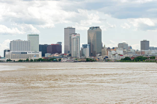 modern architecture and historic buildings of downtown new orleans louisiana and mississippi river waterfront
