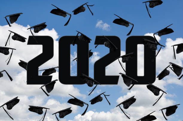 istock black 2020 graduation caps in sky 1186402593