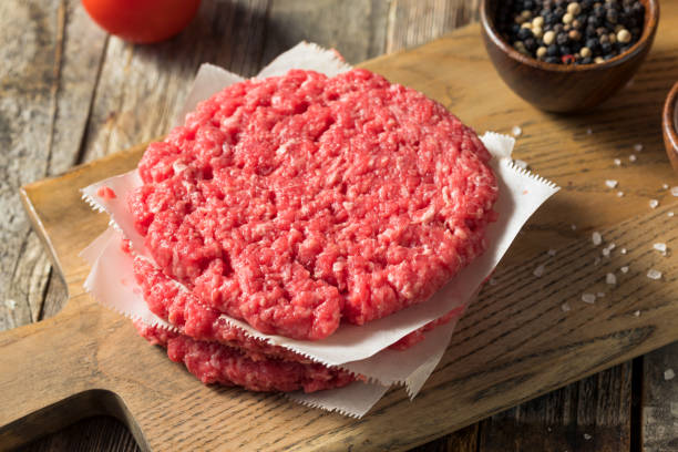 istock Raw Red Organic Hamuburger Pattys 1186410073