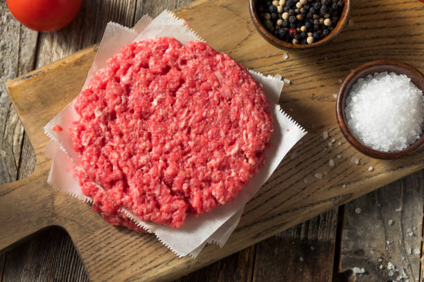istock Raw Red Organic Hamuburger Pattys 1186411418