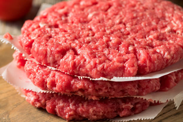 istock Raw Red Organic Hamuburger Pattys 1186411424