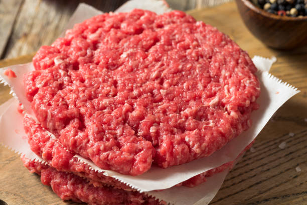 istock Raw Red Organic Hamuburger Pattys 1186411426