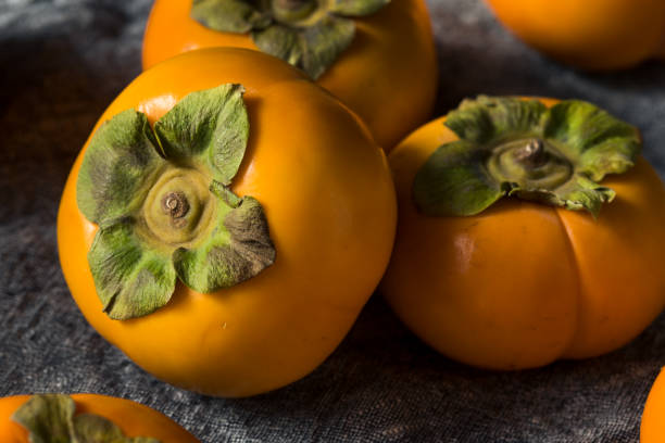 istock Raw Organic Orange Persimmons 1186411578