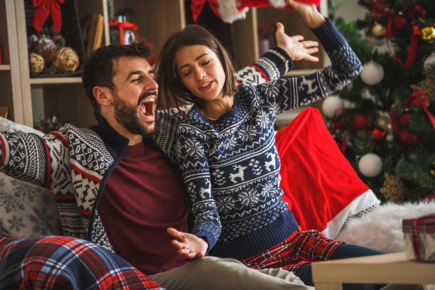 istock Young couple having fun singing together at home 1186414549