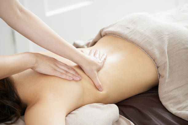 istock Woman receiving back massage 1186421653