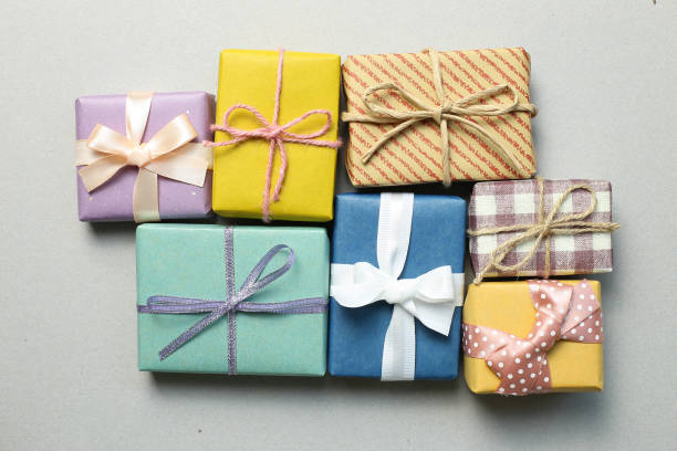 istock Gift boxes on gray background. Christmas or birthday concept 1186423803