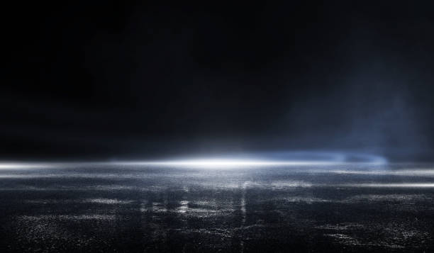istock 3D rendering abstract dark empty scene, blue neon searchlight light, wet asphalt, smoke, night view, rays. with mist light high speed 1186424543