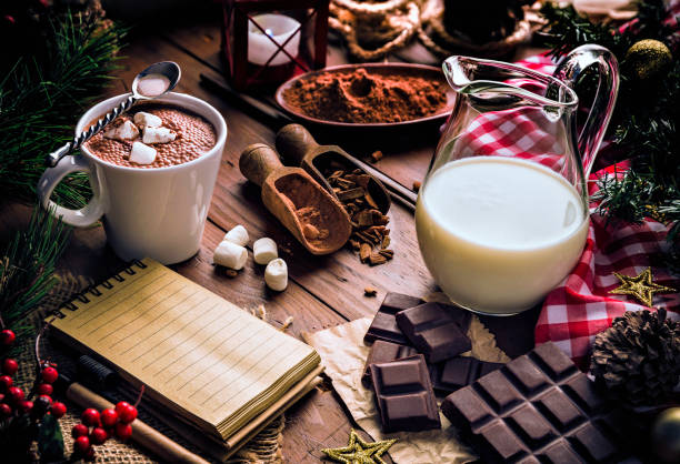 istock Christmas table setup with homemade chocolate mug, marshmallows and note pad 1186425938