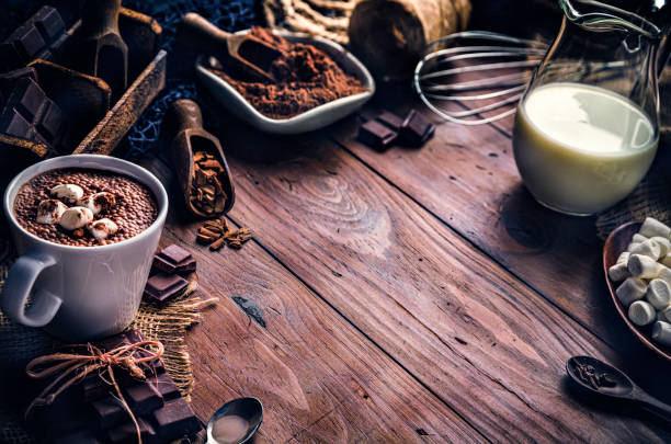 istock Christmas table setup with homemade chocolate mug, marshmallows on rustic table 1186425956