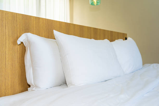istock White pillow on bed decoration interior 1186426860