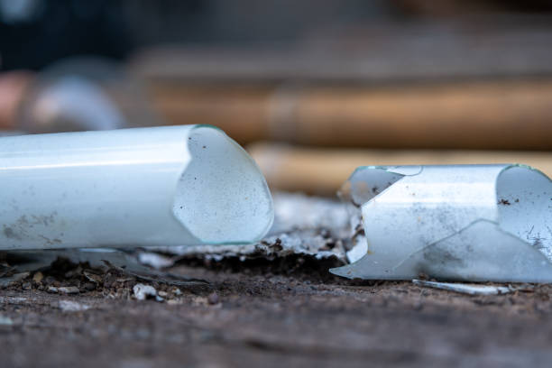 istock Select focus Pile of broken fluorescent light bulb is danger for health with blur background 1186431470